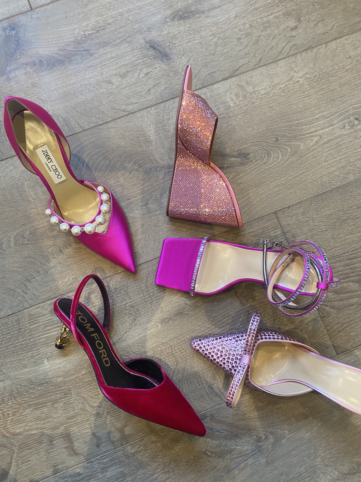 Colourful shoes arranged on a wooden floor